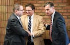 Steve Hunegs, center, executive director of the Jewish Community Relations Council, thanked FBI agent Richard Thornton, left, and Greg Brooker, acting