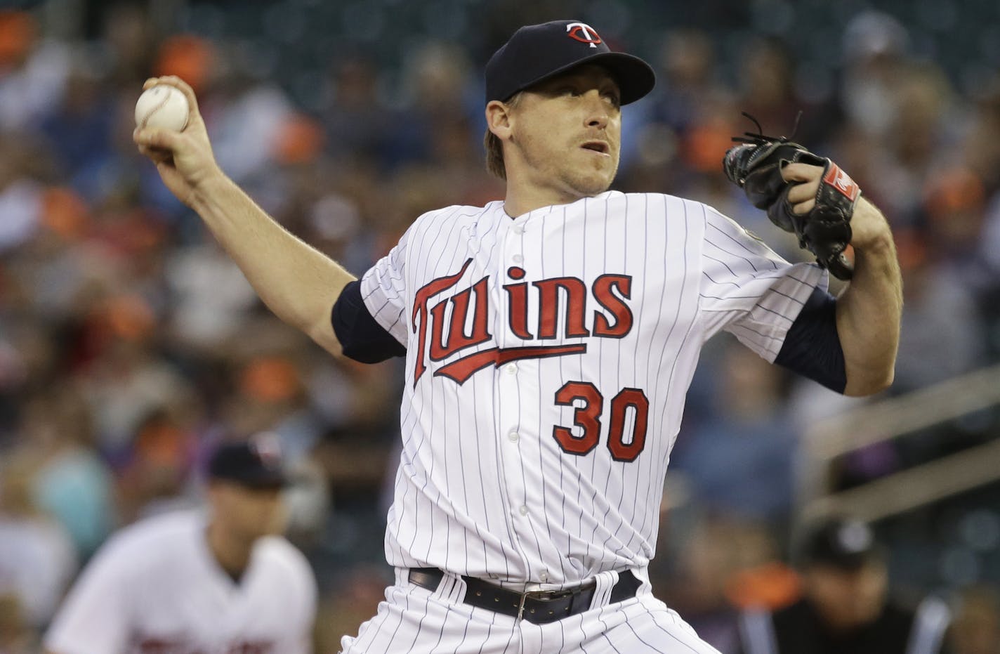 Minnesota Twins pitcher Kevin Correia throws against the Tampa Bay Rays in the first inning of a baseball game, Friday, Sept. 13, 2013 in Minneapolis. (AP Photo/Jim Mone)