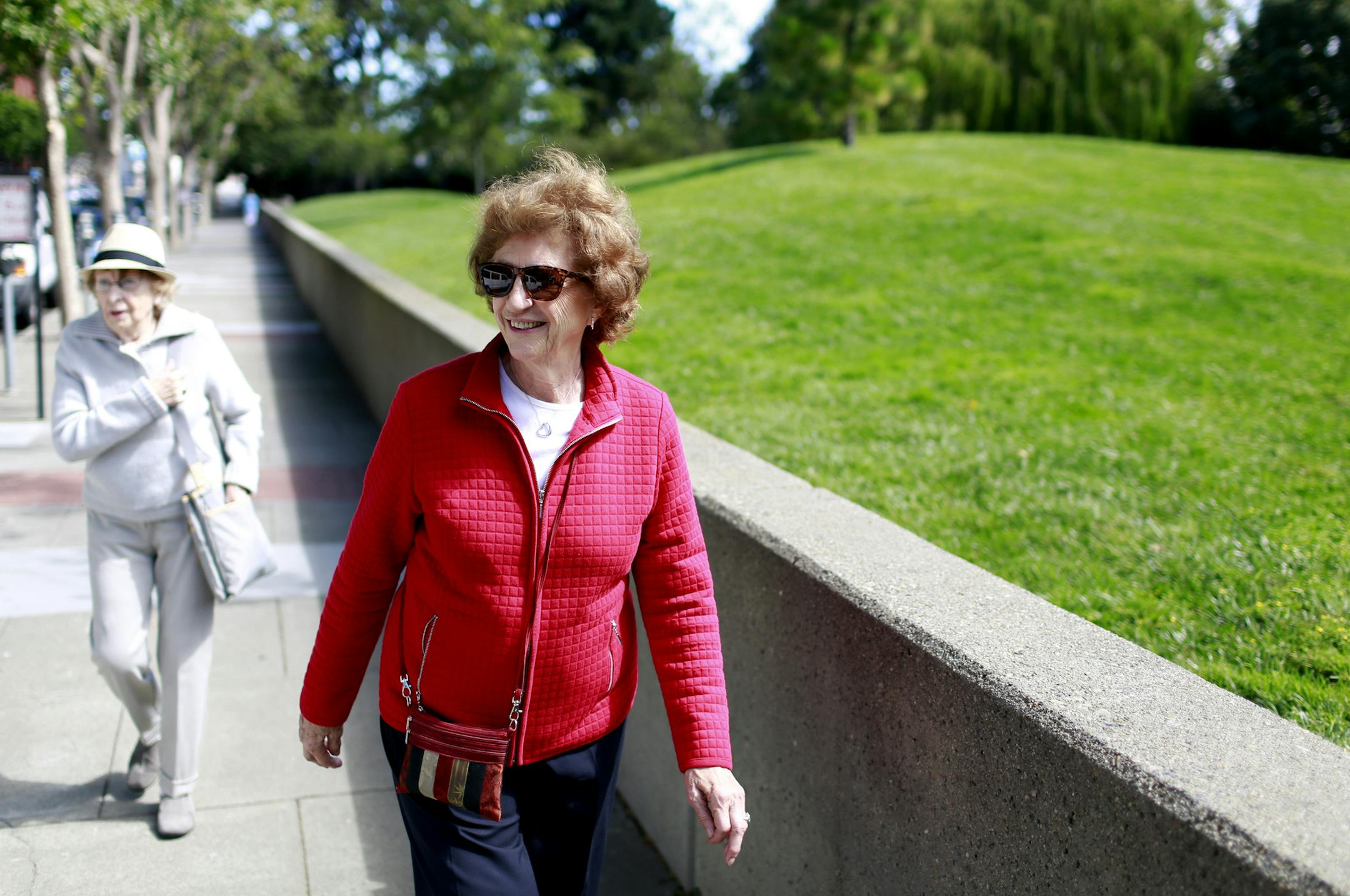 Joan Rees, right, who endured a slow recovery from a fractured pelvis suffered during a fall, and her friend Ena Macrae on their weekly Thursday morning walk in San Francisco, July 10, 2014. After a fall, life is upended in an instant — a sudden loss of independence, an awkward reliance on family and friends, and a new level of fear for those who fall, and their contemporaries. (Ramin Rahimian/The New York Times)