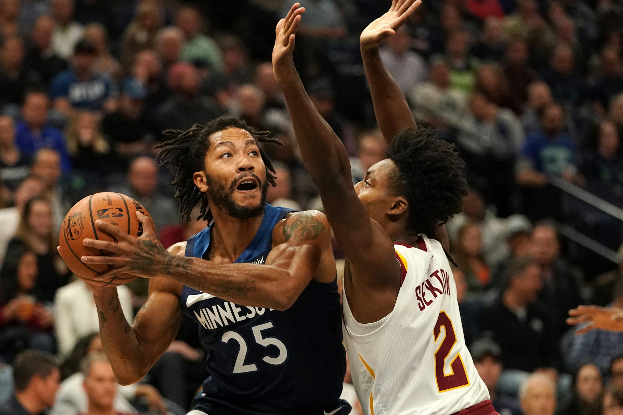 Wolves guard Derrick Rose worked around Cleveland rookie Collin Sexton in the first half Friday.