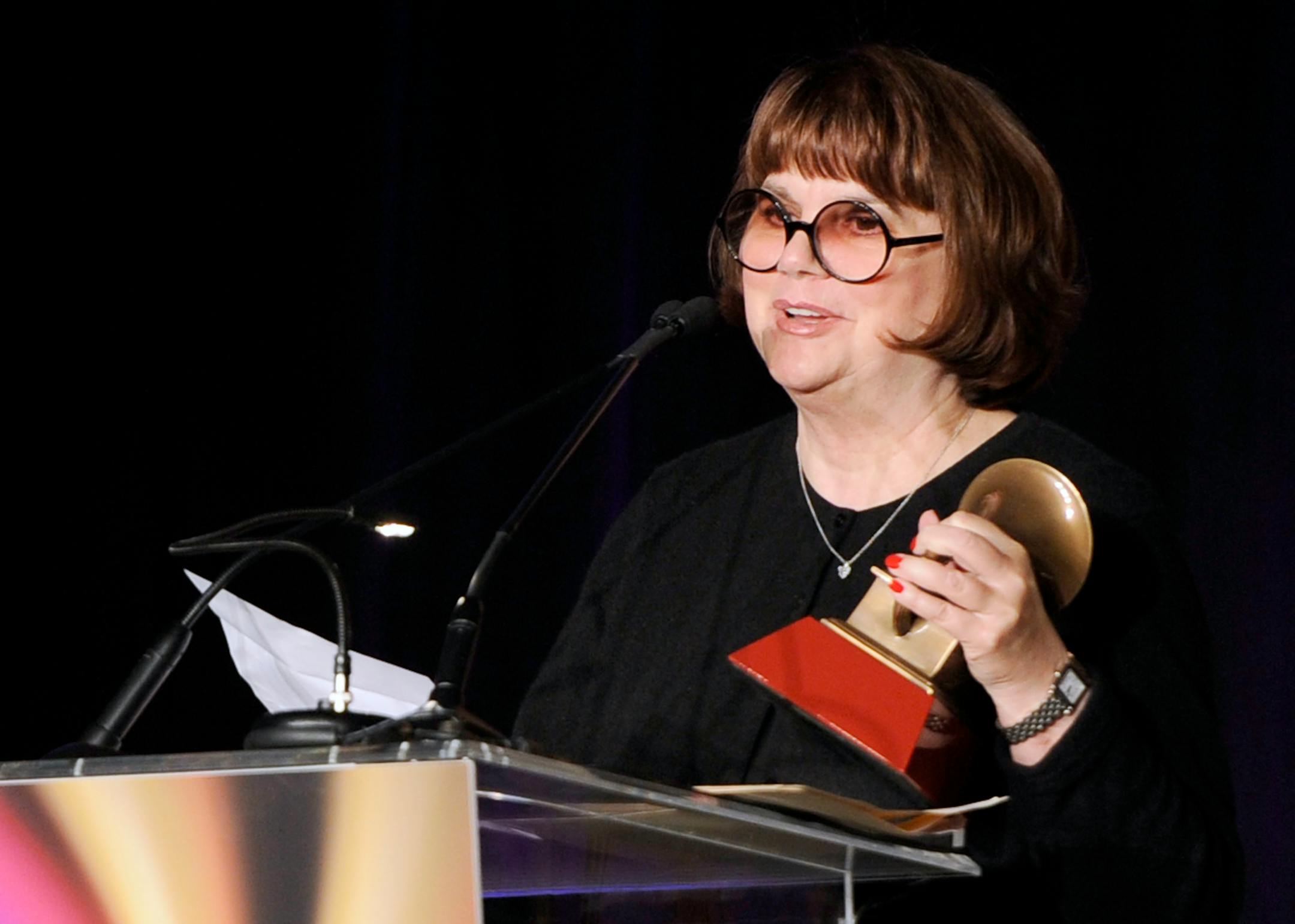 In a Nov. 9, 2011, file photo Linda Ronstadt accepts the Life Time Achievement award at the Latin Recording Academy Lifetime Achievement Award and Trustees Award ceremony in Las Vegas. In an AARP Magazine article posted online Friday, Aug. 23, 2013, Ronstadt says that she was diagnosed with Parkinson's disease and "can't sing a note."