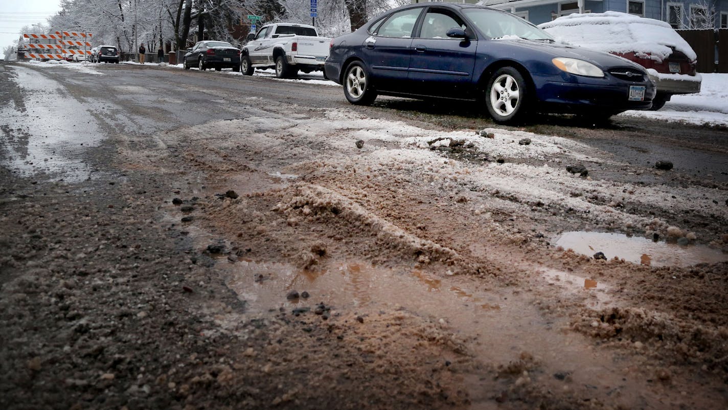 (Note to copy editors: Do not ID this as 4th Street.) Potholes riddle a street in Duluth. Cities thoughout Minnesota are asking the Legislature for money for street maintenance, but perhaps nowhere is the need more dire than in Duluth, an old city buit atop clay and hard rock. Photo by DAVID JOLES