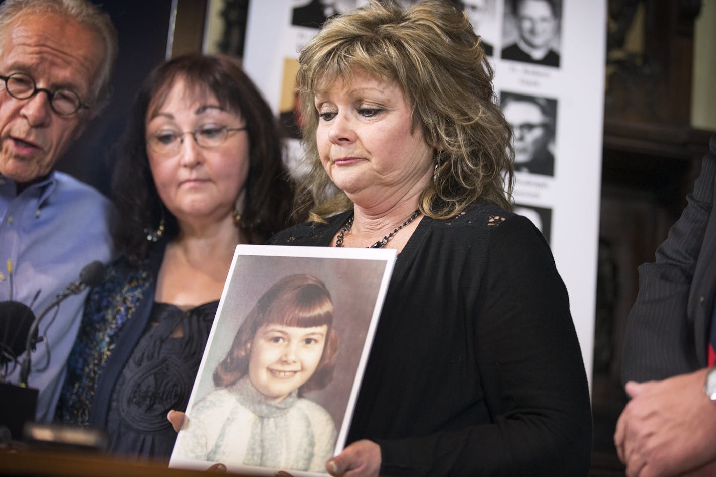 On March 29, 2016, in St. Paul, Kim Schmit, one of the victims of the Rev. David Roney, holds a photo of herself at the age when she was abused. Schmit was in grade school in 1968 when she was sexually assaulted in Willmar.