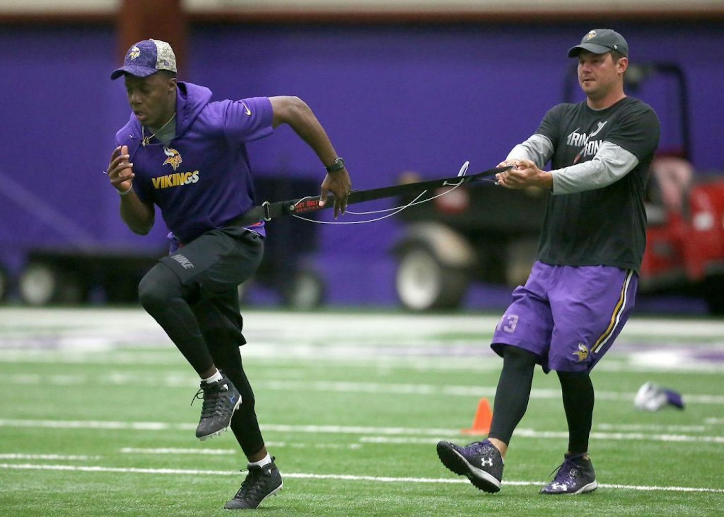 Minnesota Vikings quarterback Teddy Bridgewater, left, and Shaun Hill ran through drills during a player offseason workout at Winter Park, Tuesday, April 26, 2016 in Eden Prairie, MN.