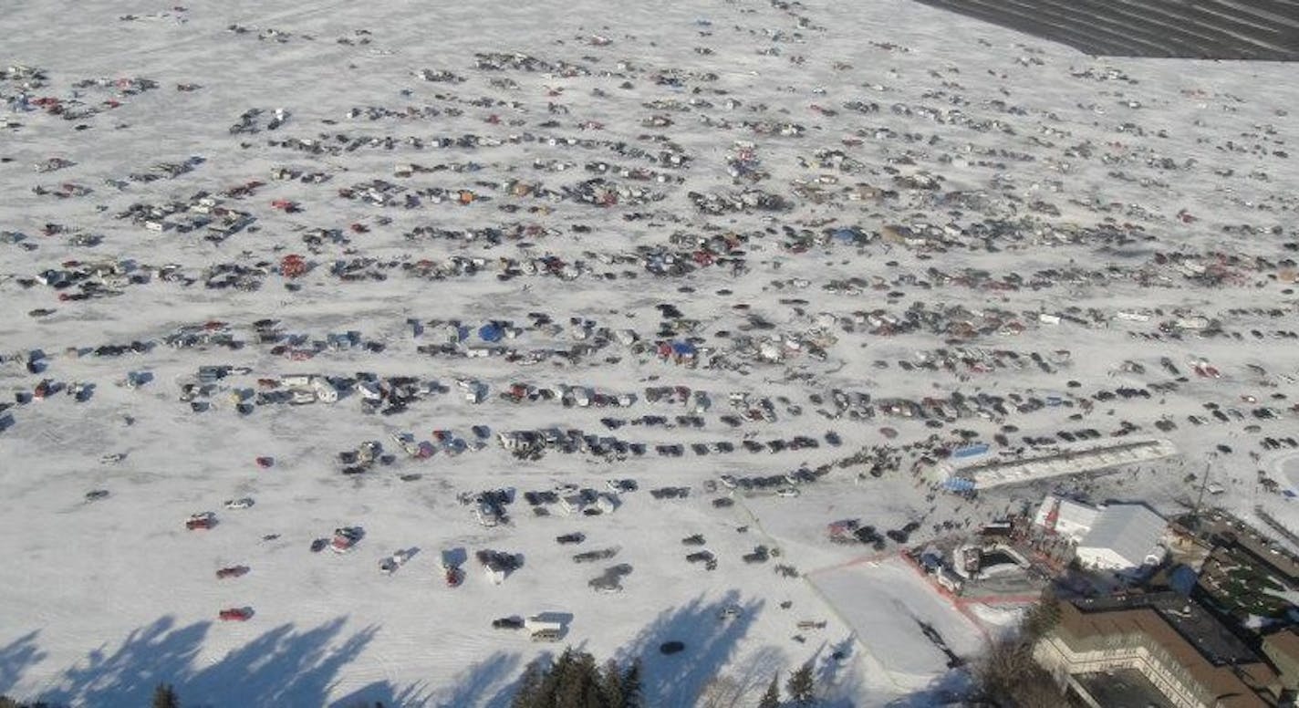 This aerial photo shows vehicles and fish houses on the ice at the 2012 International Eelpout Festival in Walker, Minn.