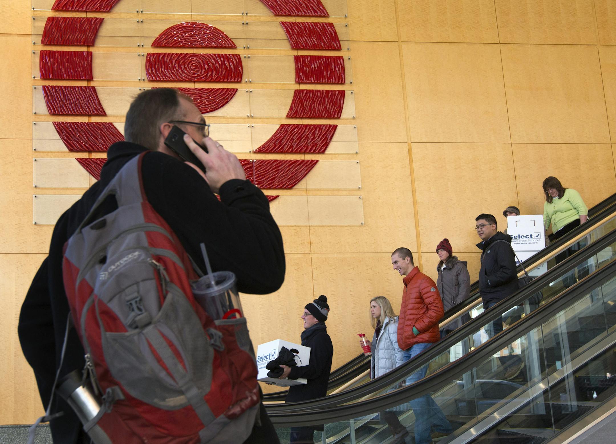 Target employees were once again filing out of Target Corporate headquarters in Downtown Minneapolis Wednesday afternoon with boxes of personal belongings after Target Corp. announced they would be laying off about 550 employees who work in the Twin Cities as it continues to wind down its Canadian business. ] BRIAN PETERSON • brianp@startribune.com Minneapolis, MN - 2/11/2015