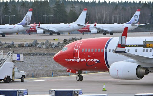 Parked Boeing 737-800 aircrafts belonging to budget carrier Norwegian seen at at Stockholm Arlanda Airport Thursday March 5, 2015. 650 pilots employed by Norwegian Air Norway (NAN) are on strike grounding flights in Norway, Sweden and Denmark. (AP Photo/Johan Nilsson / TT) SWEDEN OUT ORG XMIT: STO802