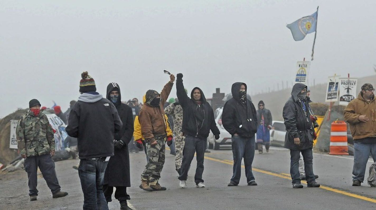 Protesters blocked Highway 1806 at the site of the New Camp on Pipeline Easement on Wednesday morning, Oct. 26, 2016.