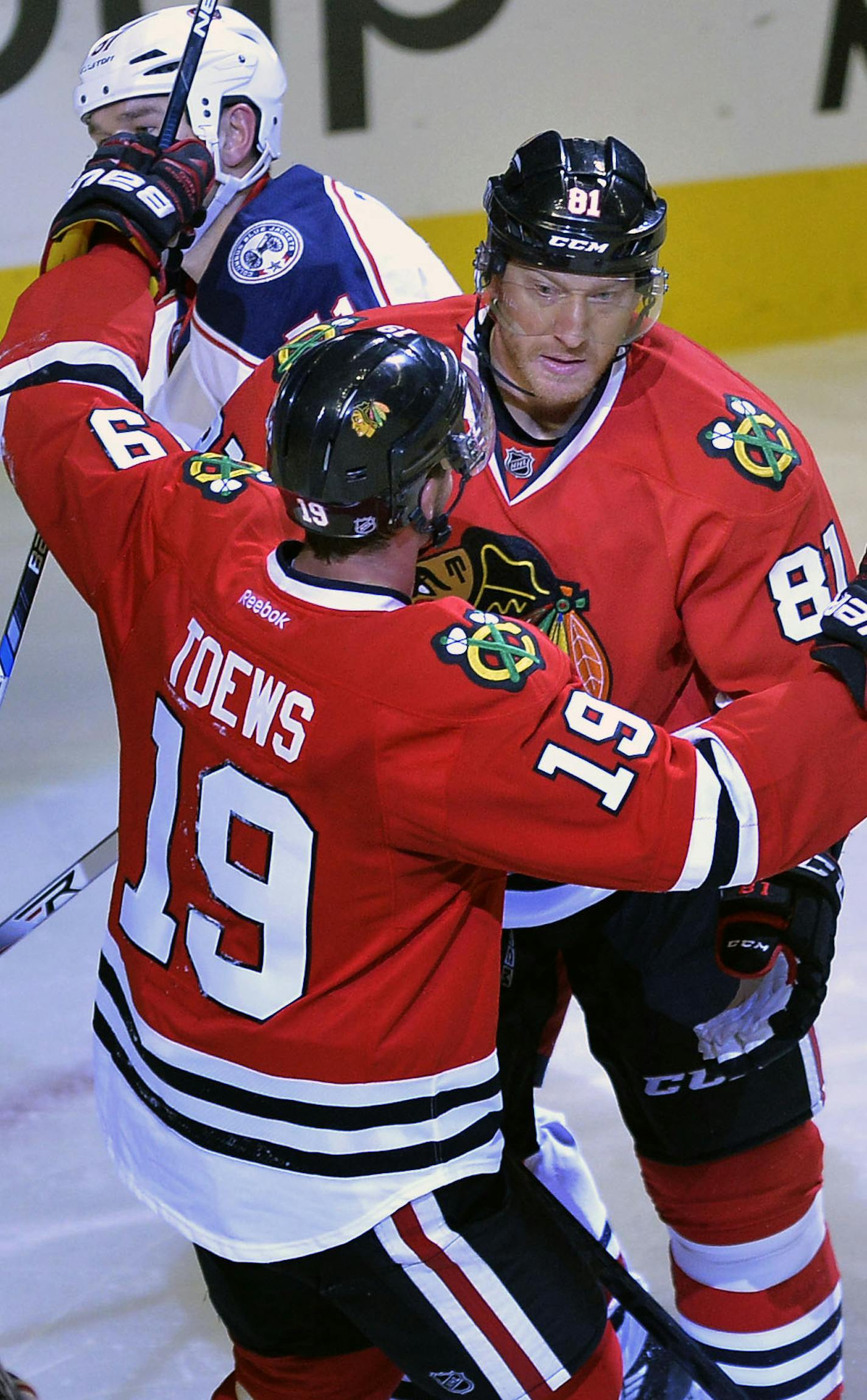 Chicago Blackhawks' Marian Hossa (81), of Slovakia, celebrates with teammate Jonathan Toews (19), after scoring during the third period of an NHL hockey game against the Columbus Blue Jackets Saturday, Oct. 17, 2015, in Chicago. Chicago won 4-1. (AP Photo/Paul Beaty) ORG XMIT: CXA108