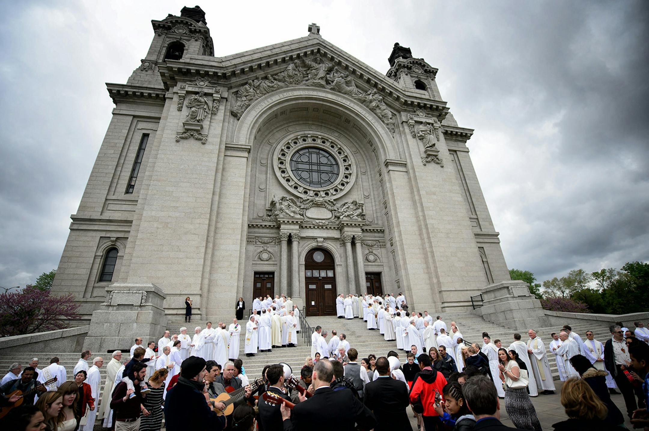 Priests and deacons lined up outside the cathedral for the start of the installation mass of Archbishop Bernard Hebda.