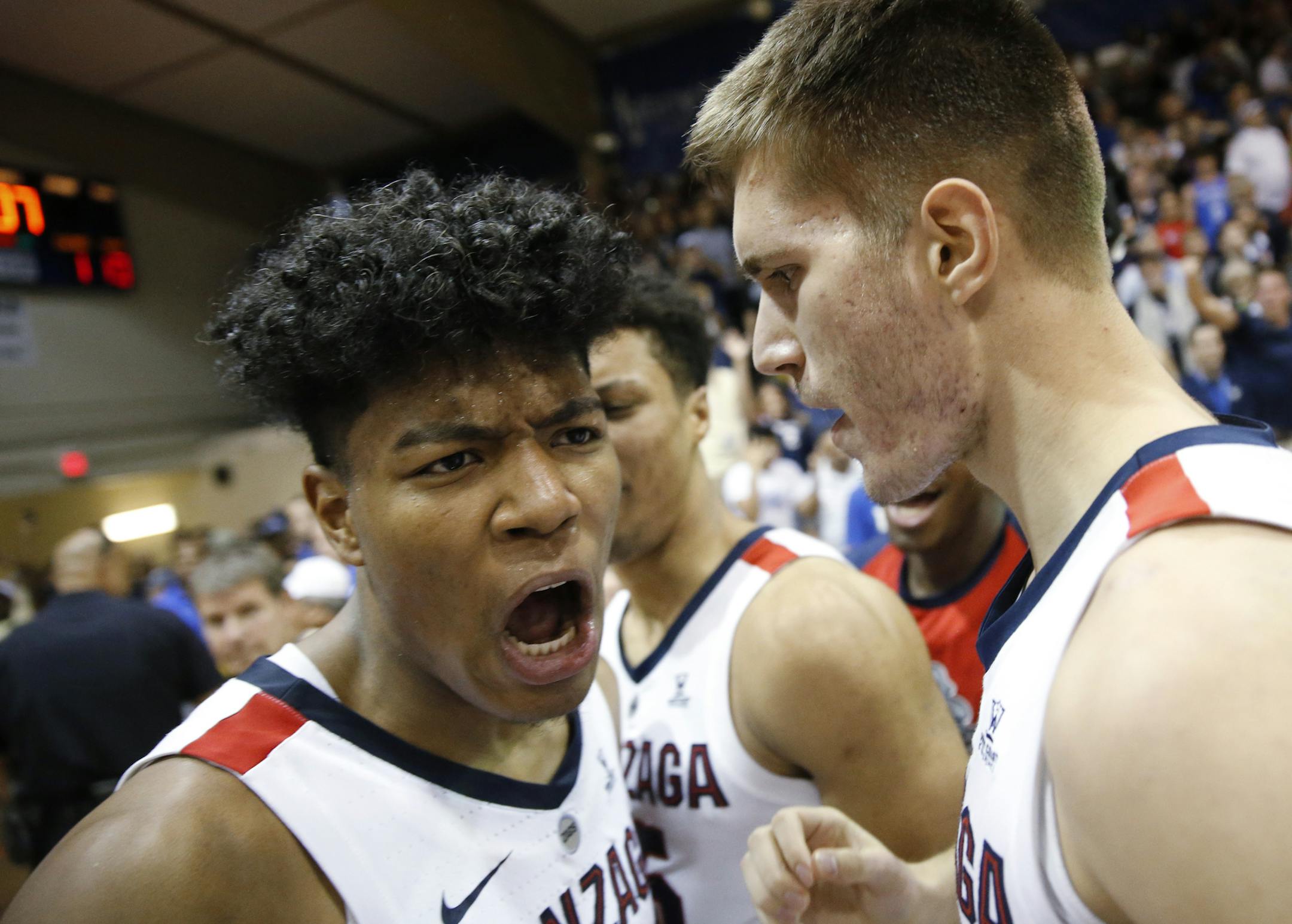 Gonzaga forward Rui Hachimura, left, and forward Filip Petrusev (3) celebrate after Gonzaga defeated Duke 89-87 to win the Maui Invitational on Wednesday.