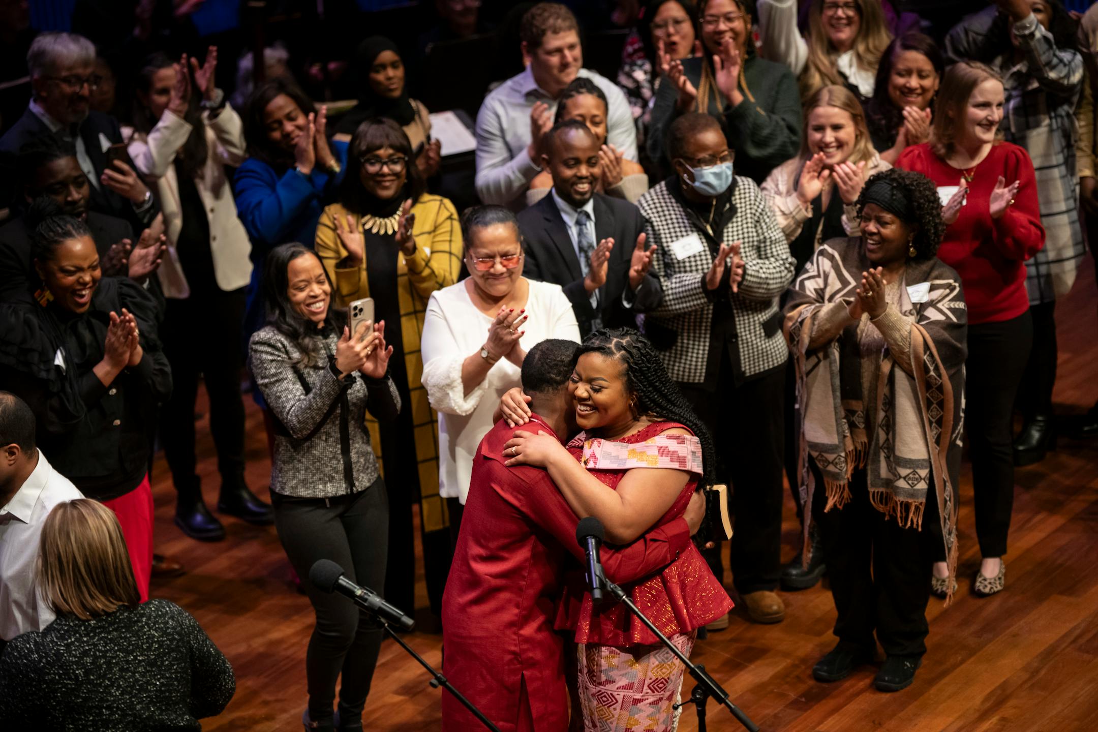 Council Member Cheniqua Johnson, Ward 7, embraces Nathan Annan after she is sworn in next to her loved ones at the swearing in ceremony of the seven female St. Paul city council members, four new to the council, at the Ordway Center on Tuesday, Jan. 9, 2024 in St. Paul, Minn. ] RENEE JONES SCHNEIDER • renee.jones@startribune.com