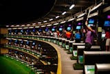 The interior of a Topgolf center.