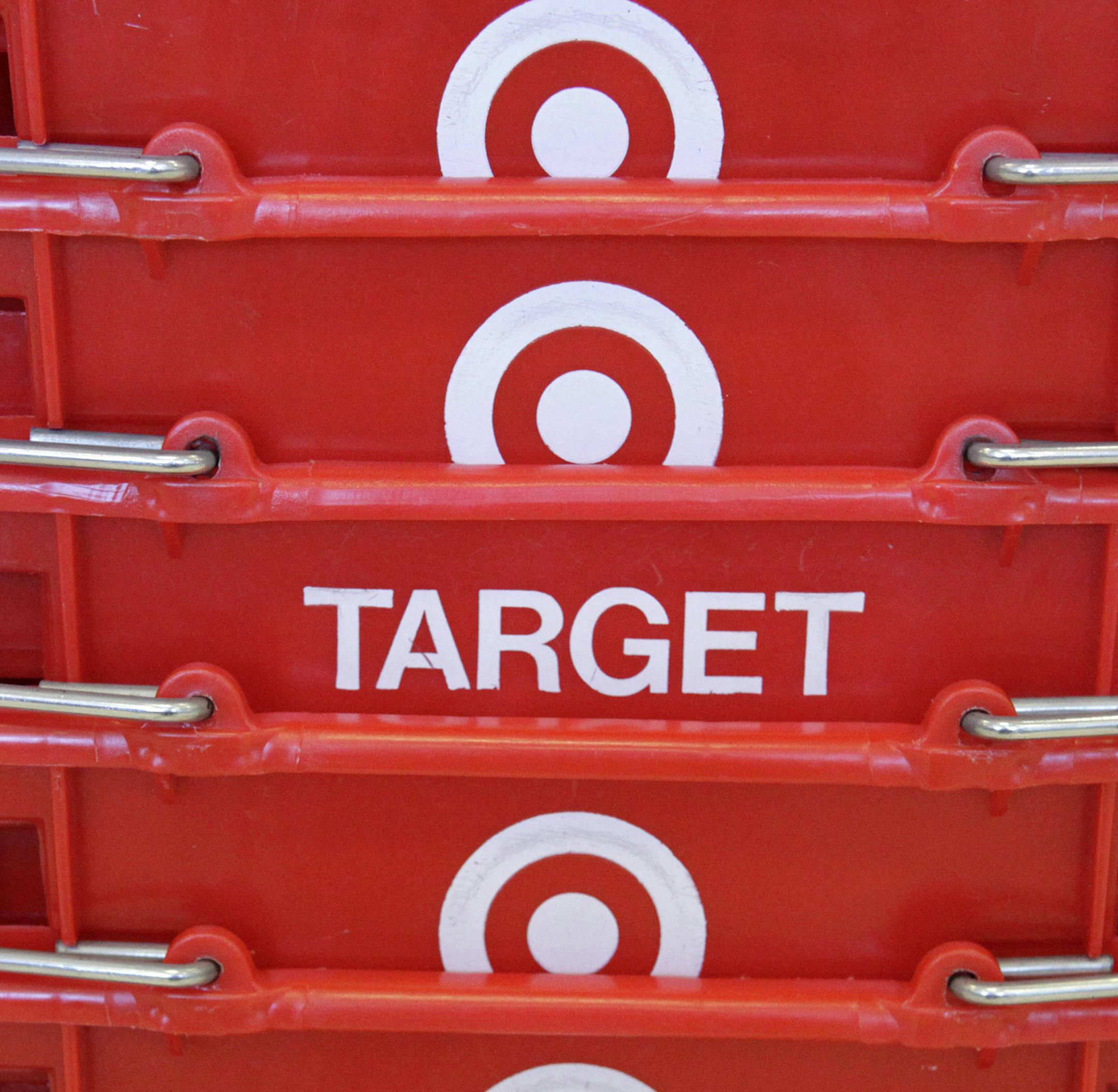 FILE - In this May 20, 2009 file photo, shopping baskets are stacked at a Chicago area Target store. Target Corp. on Tuesday, March 3, 2015 said it plans $2 billion in cost cuts over the next two years through corporate restructuring and other improvements. (AP Photo/Charles Rex Arbogast, File) ORG XMIT: MIN2015031820045771