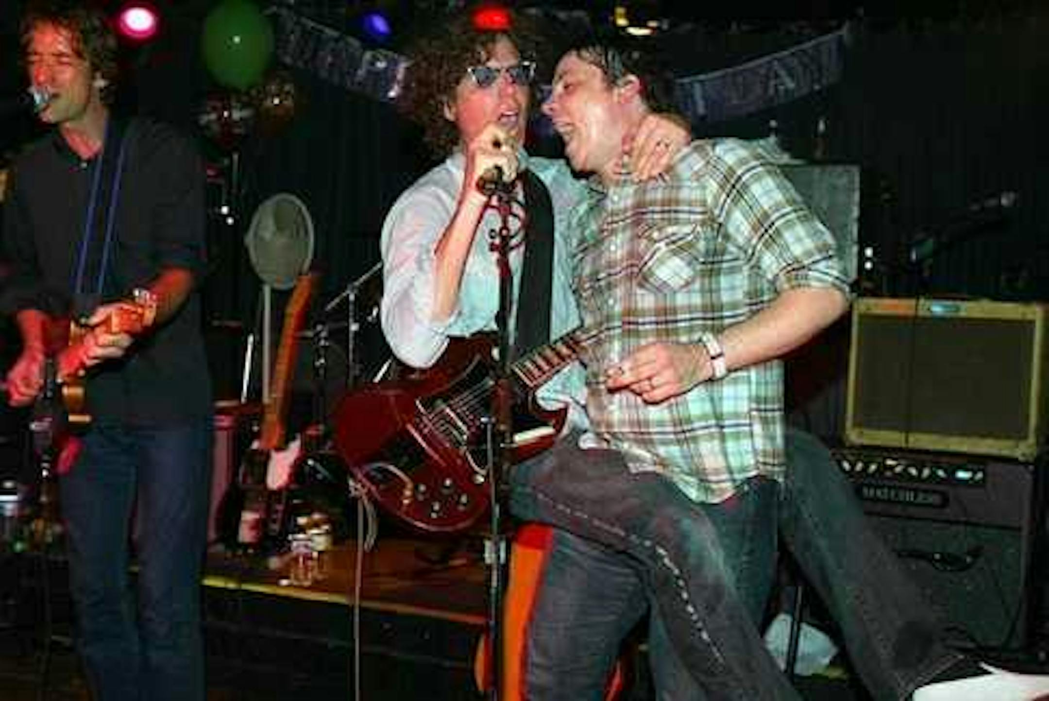 Jim Boquist, Gary Louris and Jeff Tweedy got extra close for a 2003 Golden Smog gig at the 400 Bar. / Jeff Wheeler, Star Tribune