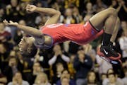 Known as the flying squirel, Ellis Coleman does a flip after clinching a spot on the U.S. Olympic Greco-Roman wrestling team.