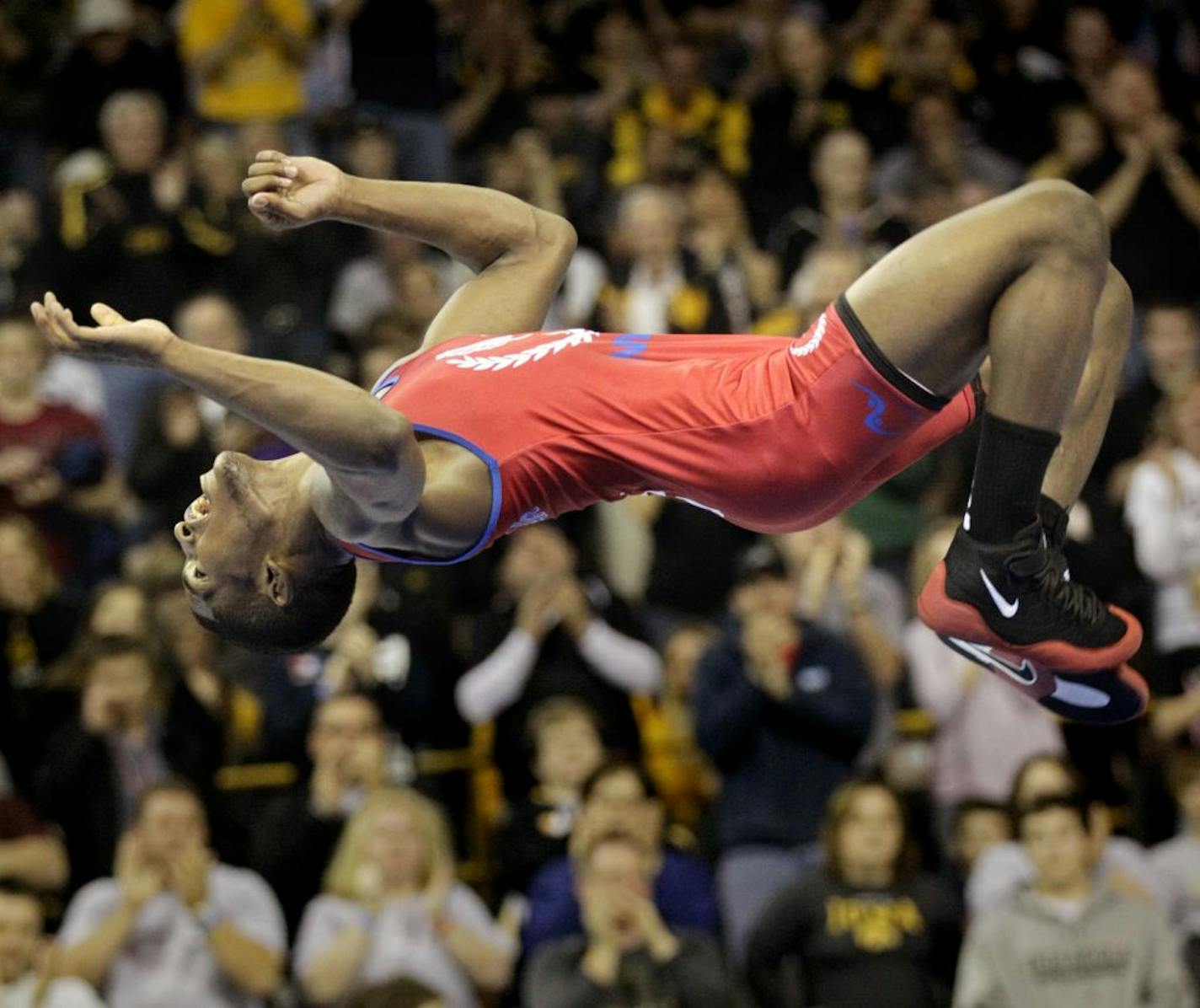 Known as the flying squirel, Ellis Coleman does a flip after clinching a spot on the U.S. Olympic Greco-Roman wrestling team.