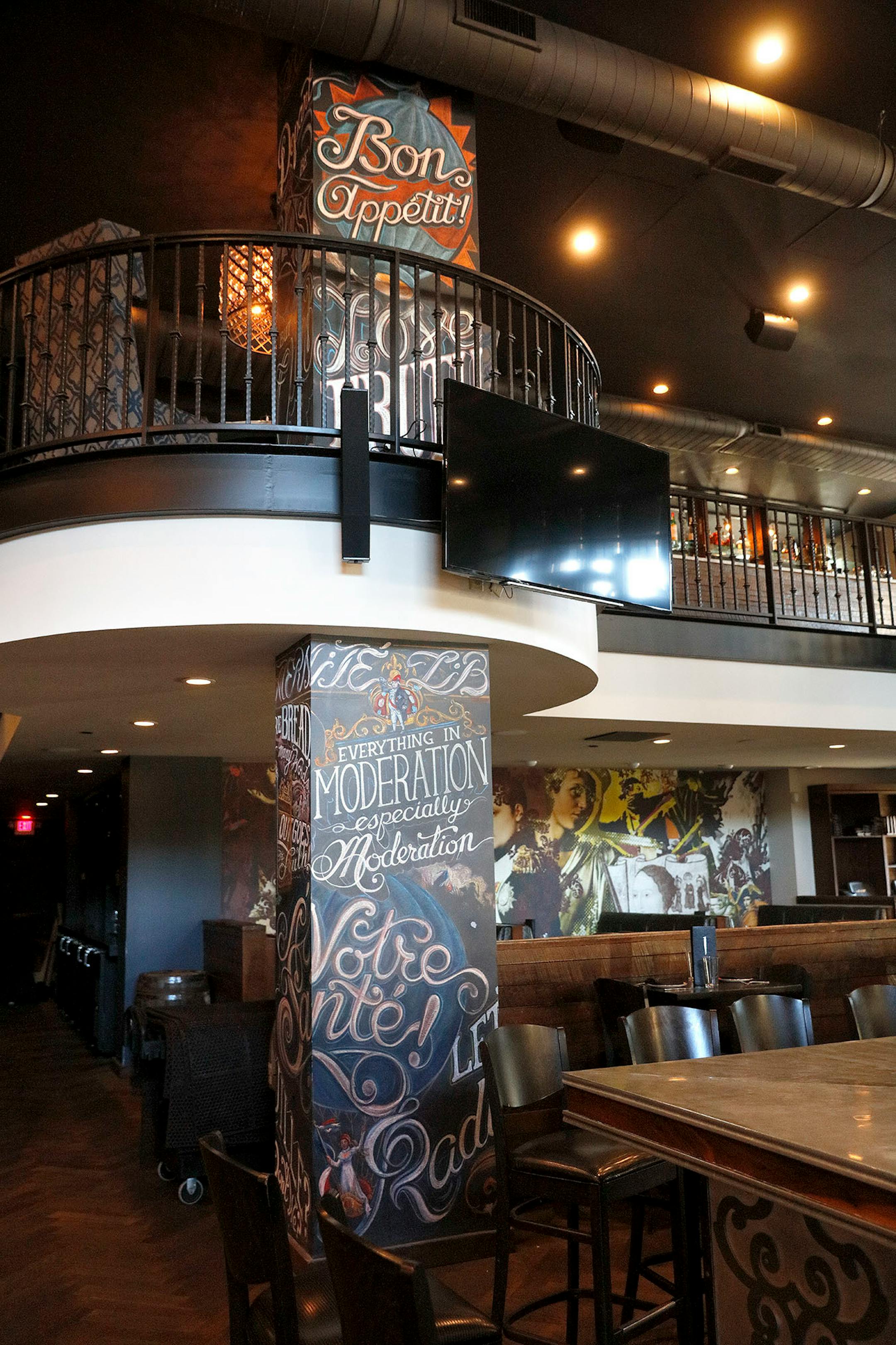 Adam Dennis work at Coup d'Etat restaurant in Uptown. Dennis' work include Smack Shack and the Pourhouse and is done with chalk and spray paint.
