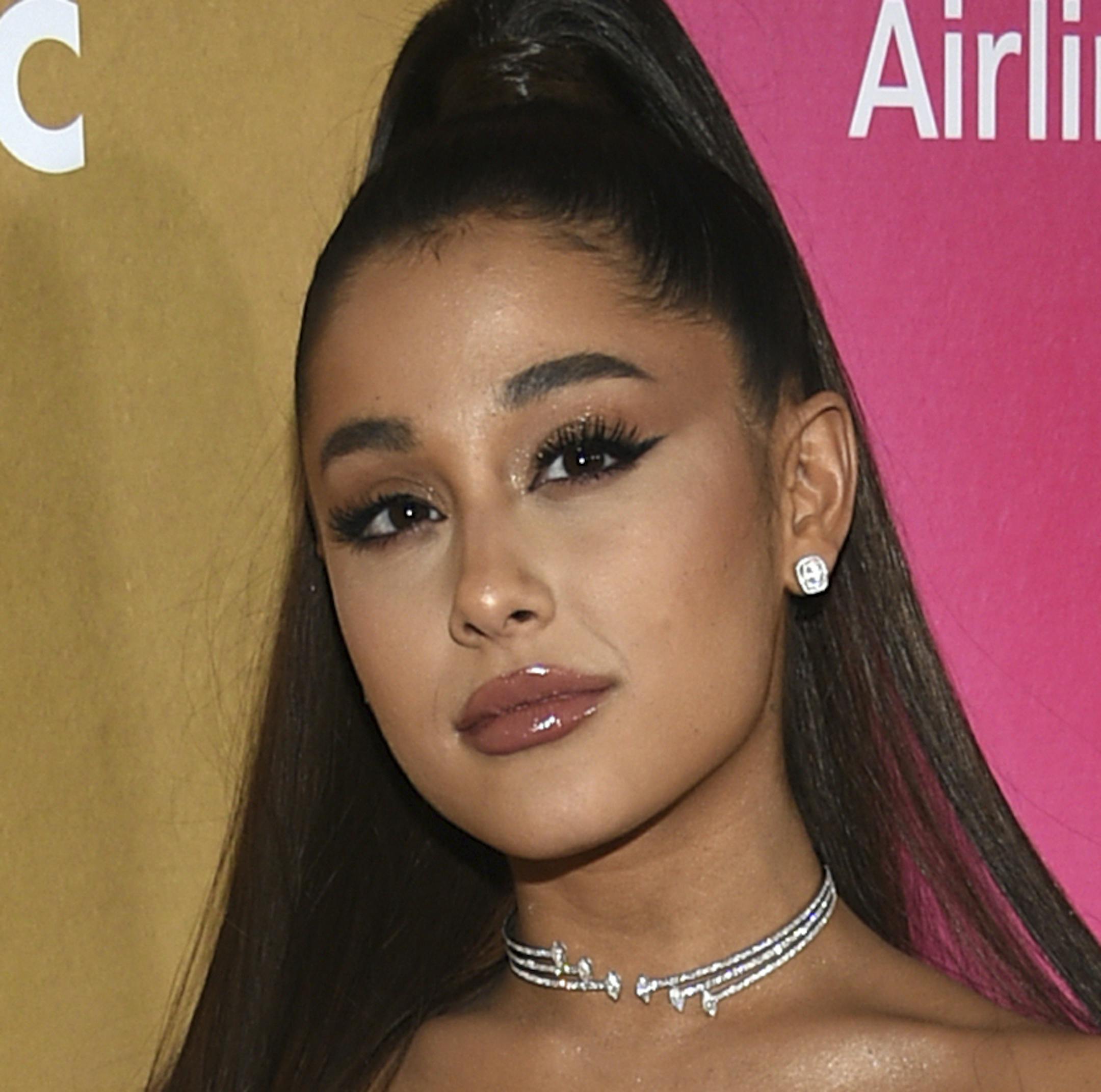 FILE - In a Thursday, Dec. 6, 2018 file photo, Ariana Grande attends the 13th annual Billboard Women in Music event at Pier 36, in New York. Ariana Grande has cancelled a Las Vegas performance scheduled for Saturday, Dec. 29, 2018 "due to unforeseeable health reasons.”(Photo by Evan Agostini/Invision/AP, File)