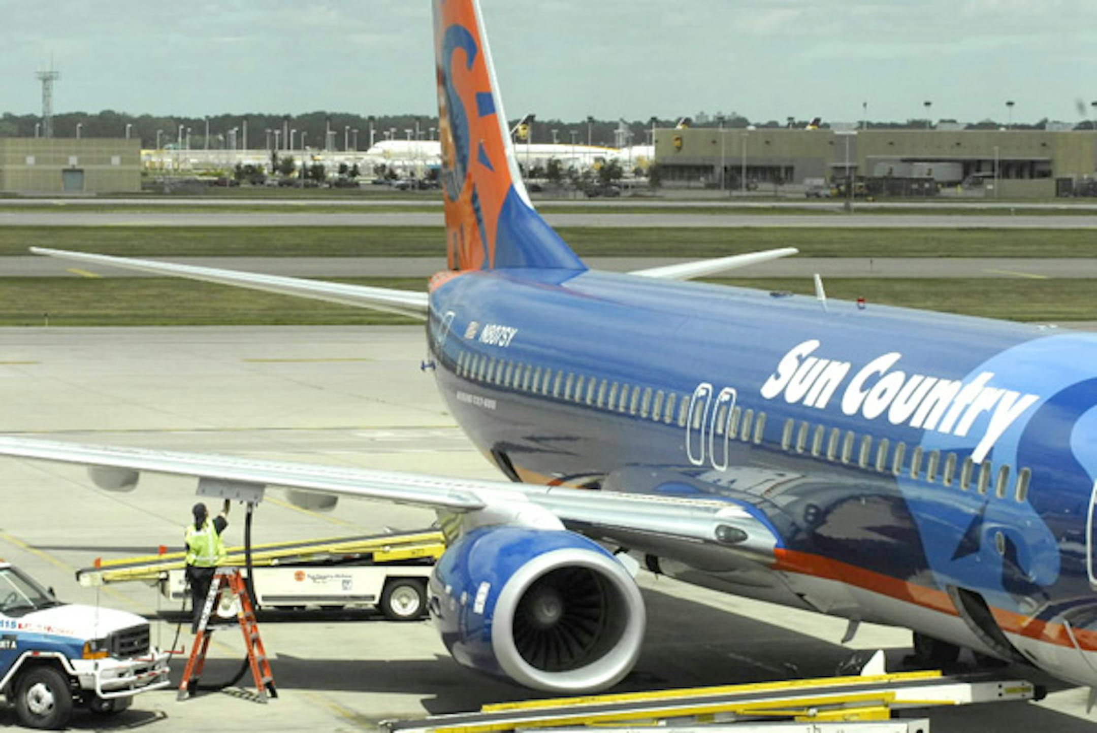 A Sun Country Airlines Boeing 737-800 is fueled at Minneapolis-St. Paul International Airport.