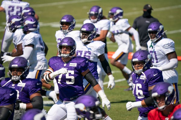 Vikings tackle Brian O'Neill loosened up with the rest of the team at the start of practice Monday.