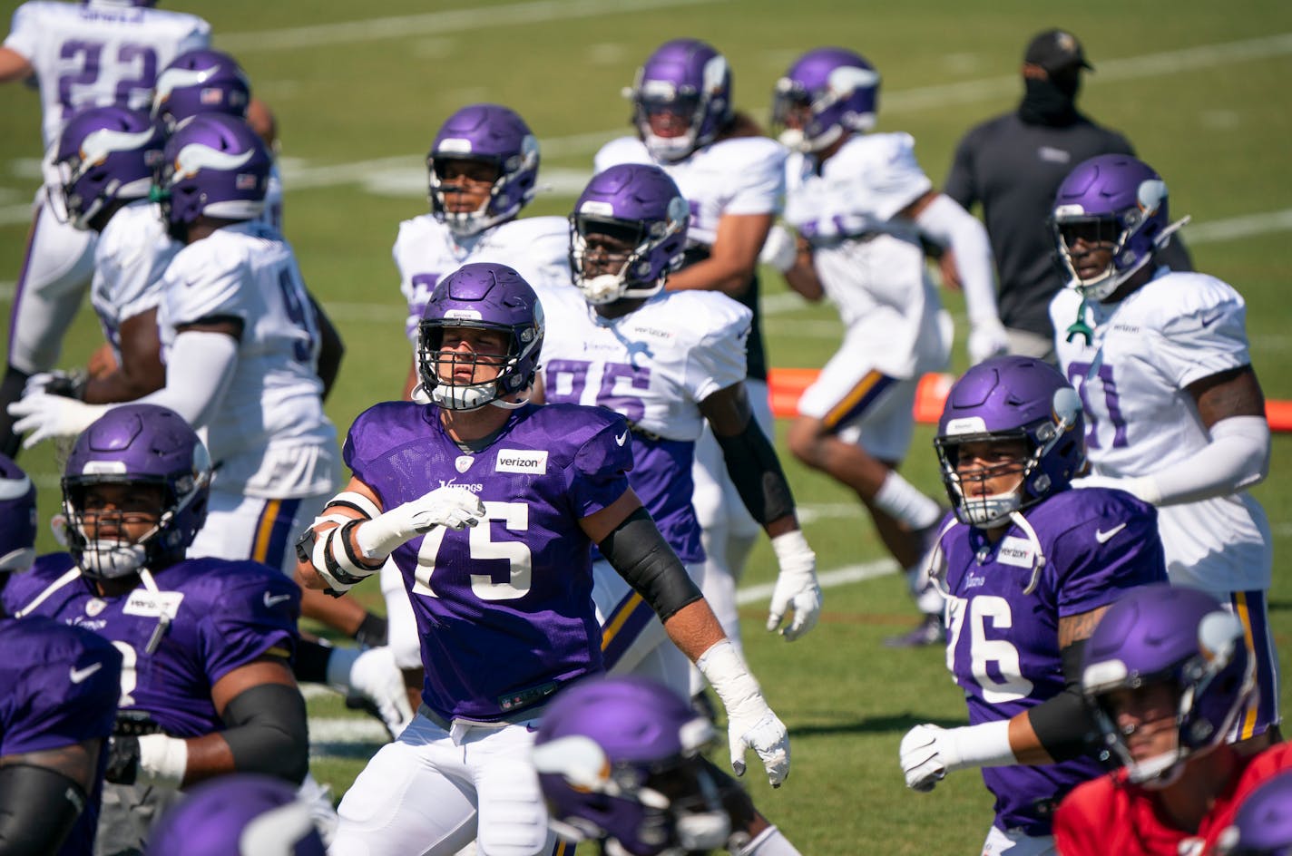 Vikings tackle Brian O'Neill loosened up with the rest of the team at the start of practice Monday.