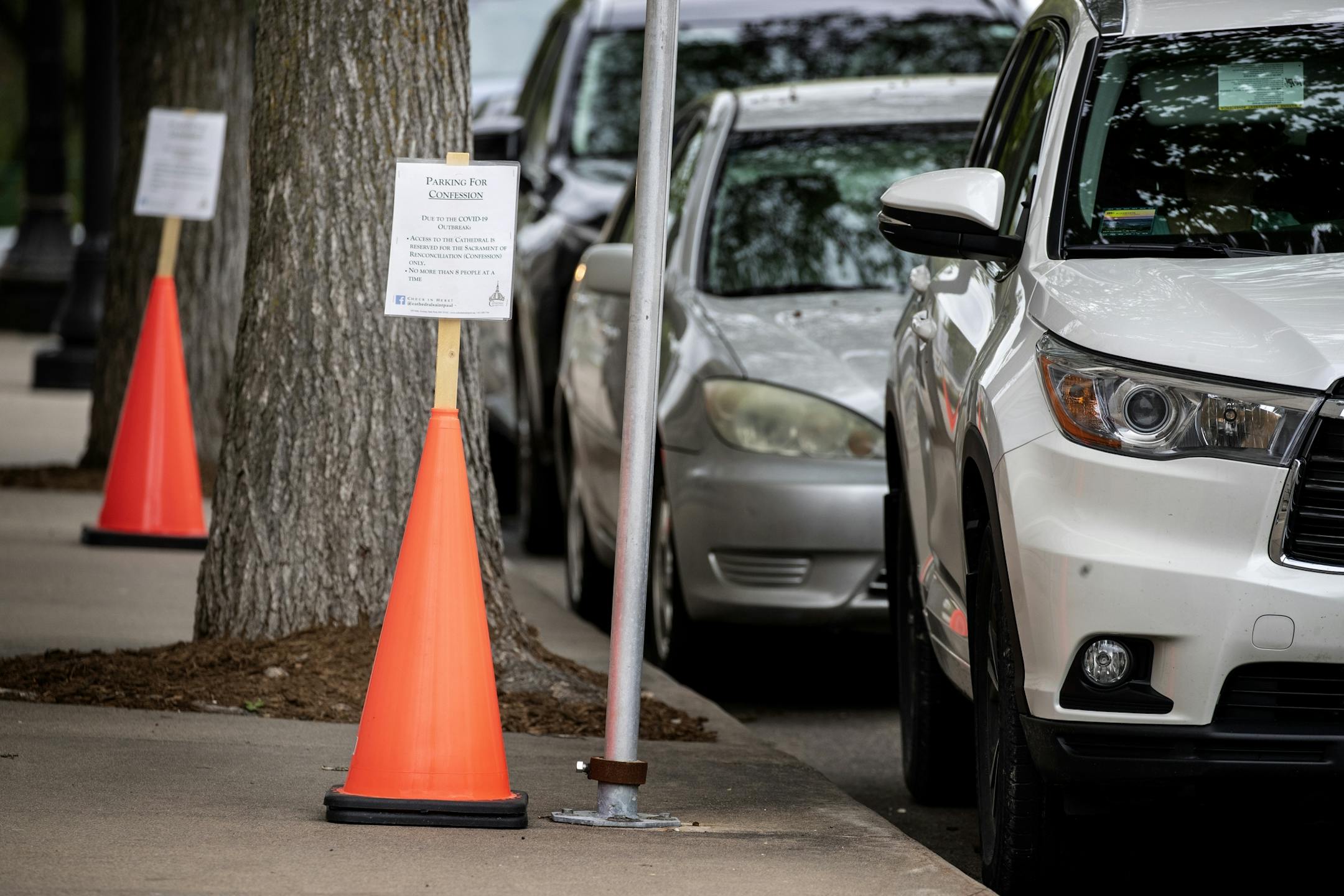 Cars lined up along Selby Ave. near the St. Paul Cathedral for confession. The Cathedral allows under 10 people inside at a time for confessions.