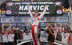 Kevin Harvick celebrated in Victory Lane after winning the NASCAR Cup Series auto race at Texas Motor Speedway in Fort Worth