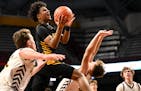 Nasir Whitlock of DeLaSalle took the high road on a drive against Stewartville in the first half Tuesday, March 21, 2023 during a Class 3A boys' baske