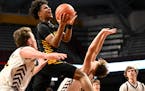 Nasir Whitlock of DeLaSalle took the high road on a drive against Stewartville in the first half Tuesday, March 21, 2023 during a Class 3A boys' baske