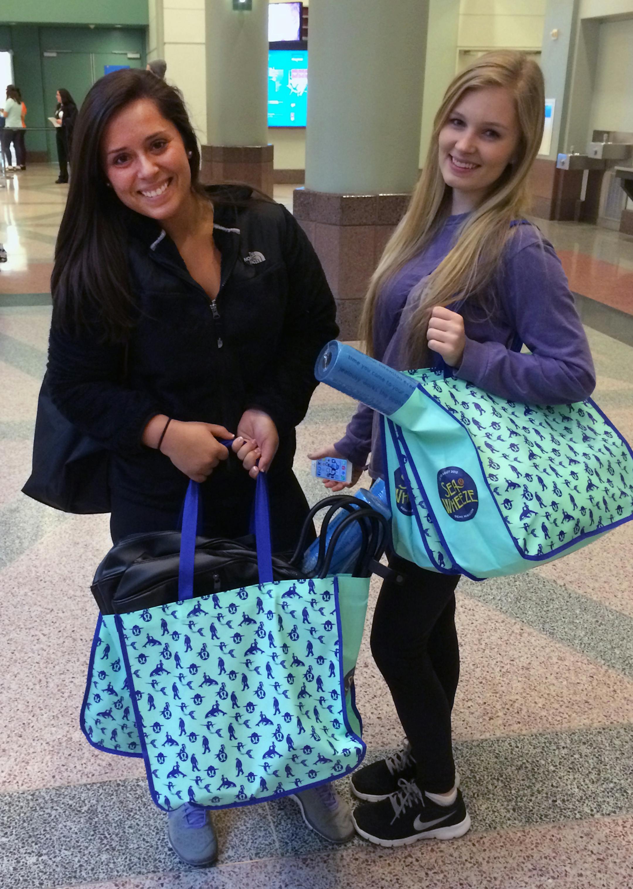 Lauren Rowan and Taylor Munson of St. Paul each purchased about 20 items at the Lululemon warehouse sale at the Minneapolis Convention Center. The sale limits each customer to 25 items. ] Minneapolis, MN 3/28/2014
