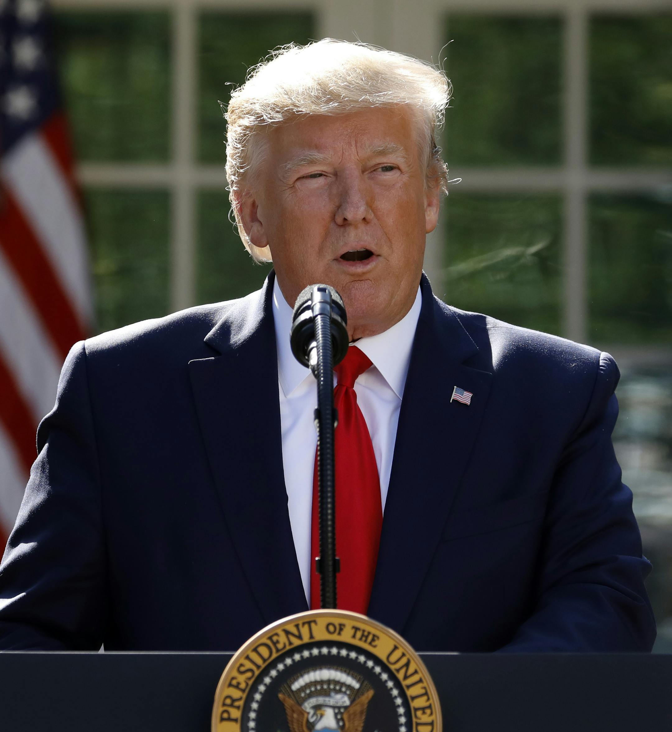 President Donald Trump says he is postponing his weekend trip to Poland and will send Vice President Mike Pence in his place during a event to announce the establishment of the U.S. Space Command in the Rose Garden of the White House in Washington, Thursday, Aug. 29, 2019. (AP Photo/Carolyn Kaster)