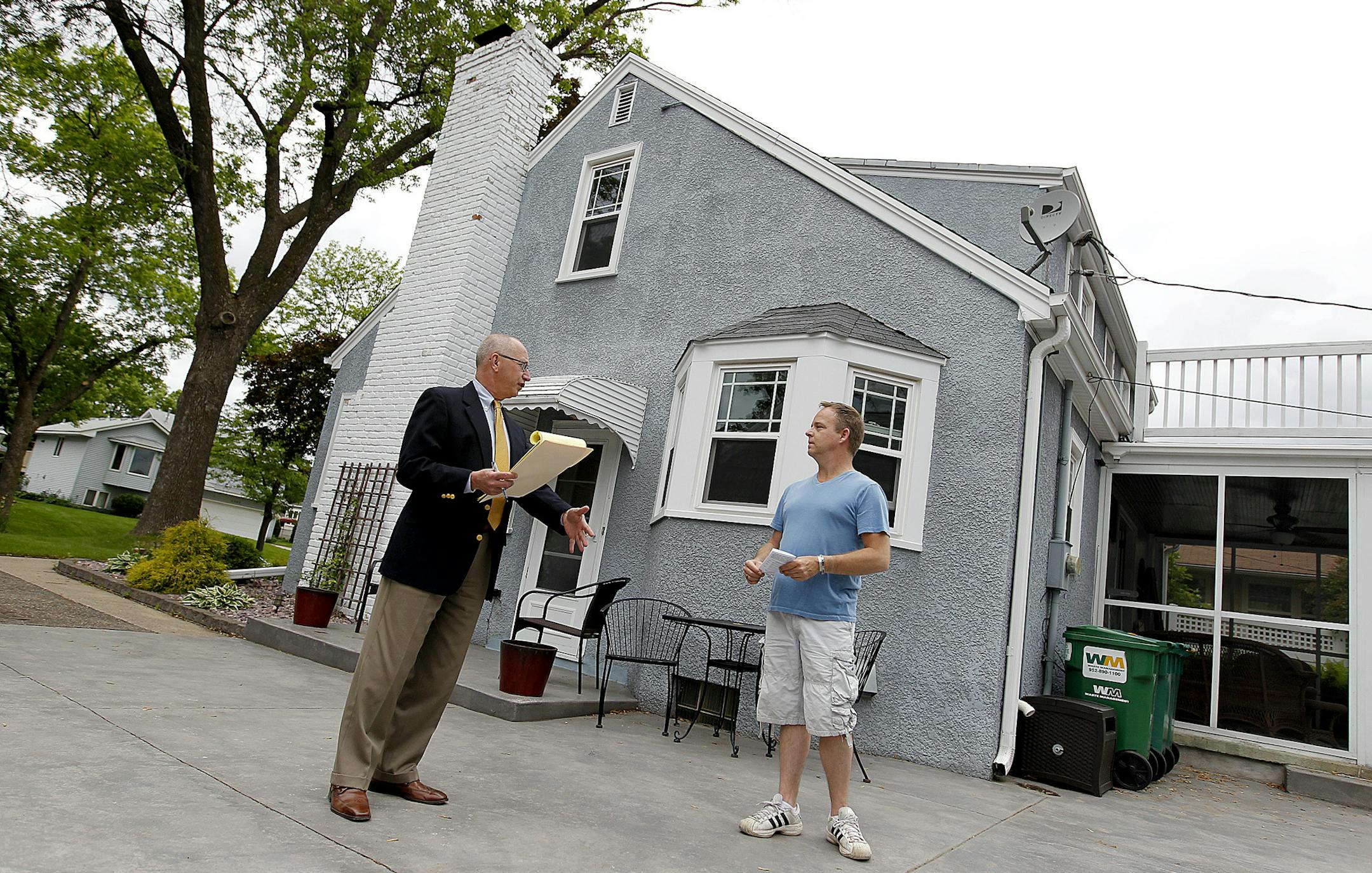 Jim Wavra, right, who is getting ready to list his house, gave Business Development Director B. Patrick Ruble a tour of his home for a home analysis, Tuesday, June 4, 2013. (ELIZABETH FLORES/STAR TRIBUNE) ELIZABETH FLORES • eflores@startribune.com