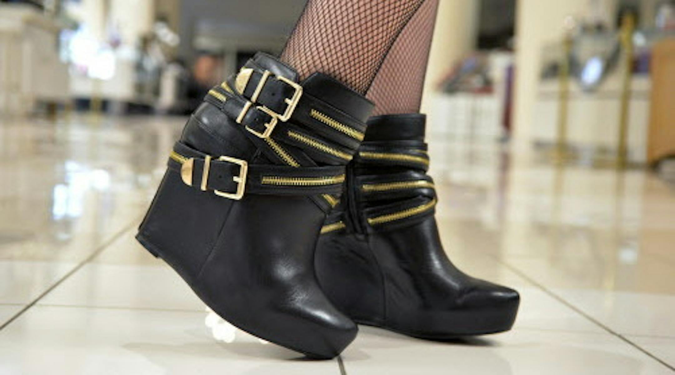 Erin Wahl. 34. Downtown Minneapolis. Job: Macy's Visual Department. Favorite item: BCBG boots, hard clutch. "I just bought the boots. They'll go great in the winter since we didn't have much of a summer." "I stumbled across a boutique in San Diego and found the hard clutch and just loved it." ] (SPECIAL TO THE STAR TRIBUNE/BRE McGEE) **Erin Wahl