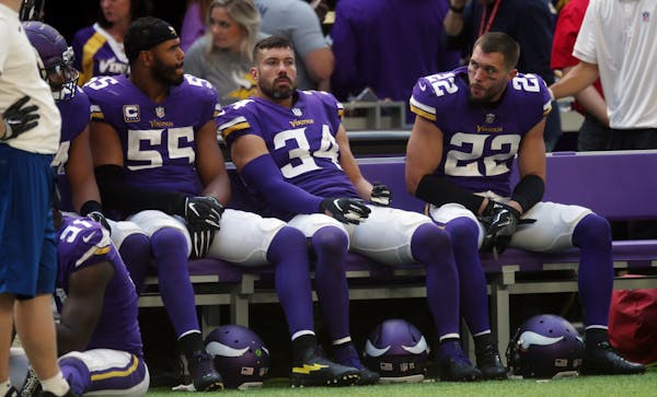 Vikings players Anthony Barr, from left, Andrew Sendejo and Harrison Smith sat on the bench aft the end of Sunday's loss to the Bills.