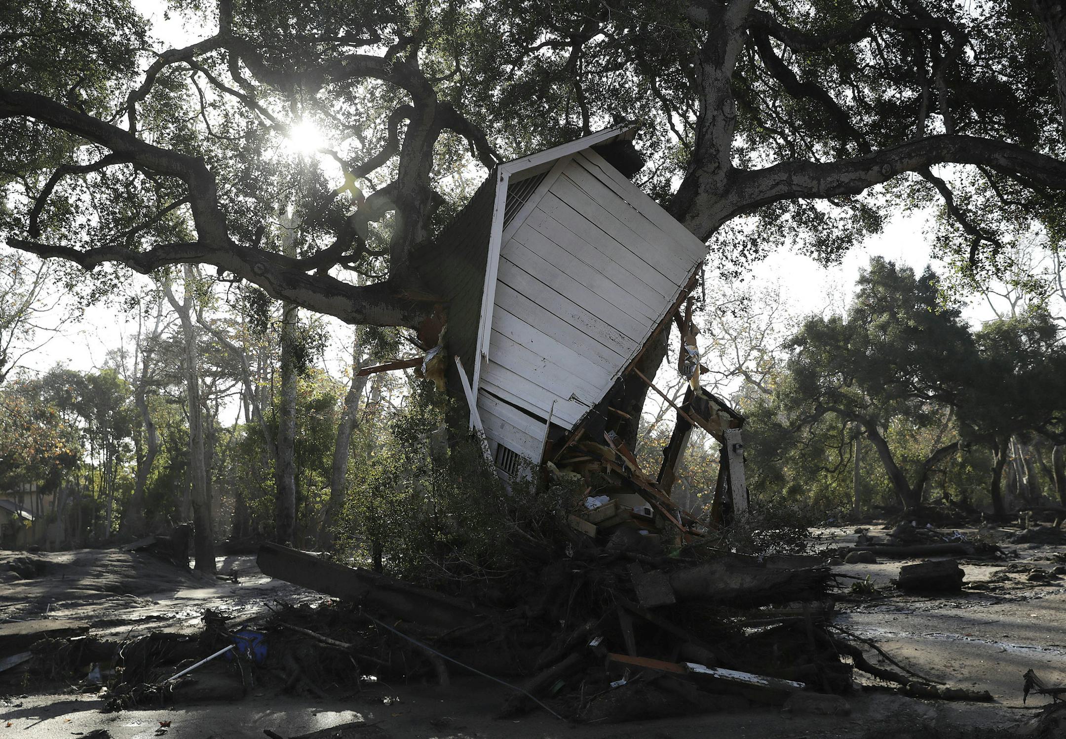 A structure damaged from storms is shown in Montecito, Calif., Thursday, Jan. 11, 2018. Hundreds of rescue workers slogged through knee-deep ooze and used long poles to probe for bodies Thursday as the search dragged on for victims of the mudslides that slammed this wealthy coastal town. (AP Photo/Marcio Jose Sanchez)