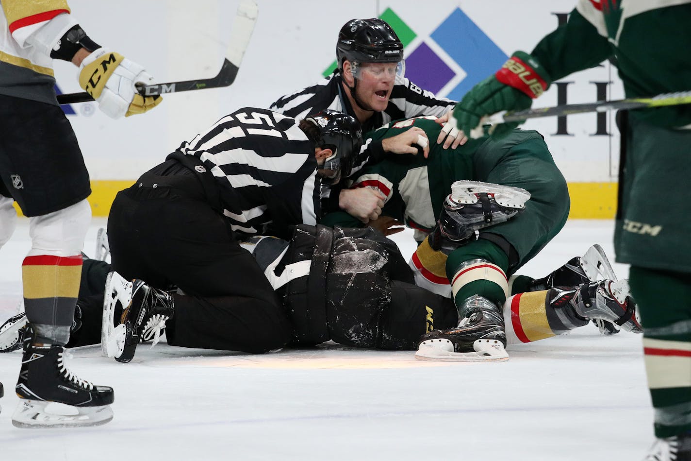 Minnesota Wild defenseman Matt Dumba (24) and Vegas Golden Knights center Ryan Carpenter (40) were separated by officials on the ice after getting into a fist fight in the second period. ] ANTHONY SOUFFLE • anthony.souffle@startribune.com