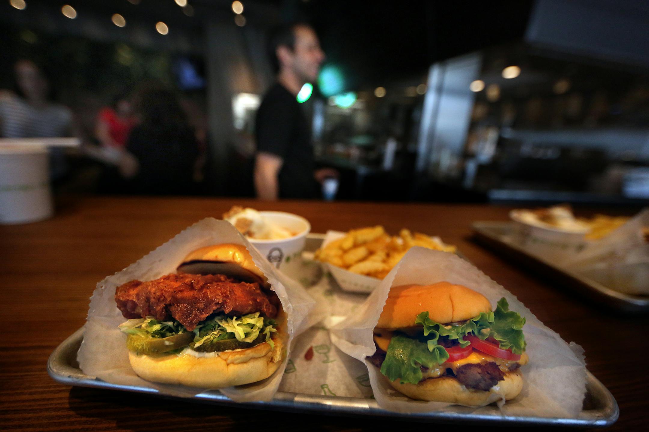 Items on the Shake Shack menu include: a ShackBurger (right); Chickín Shack; fries and a Malt of America. ] JIM GEHRZïjames.gehrz@startribune.com (JIM GEHRZ/STAR TRIBUNE) / June 9, 2016/ 10:30 PM , Bloomington, MN - BACKGROUND INFORMATION: Shake Shack opens its first Minnesota location at Mall of America and the crowds are expected to be huge.