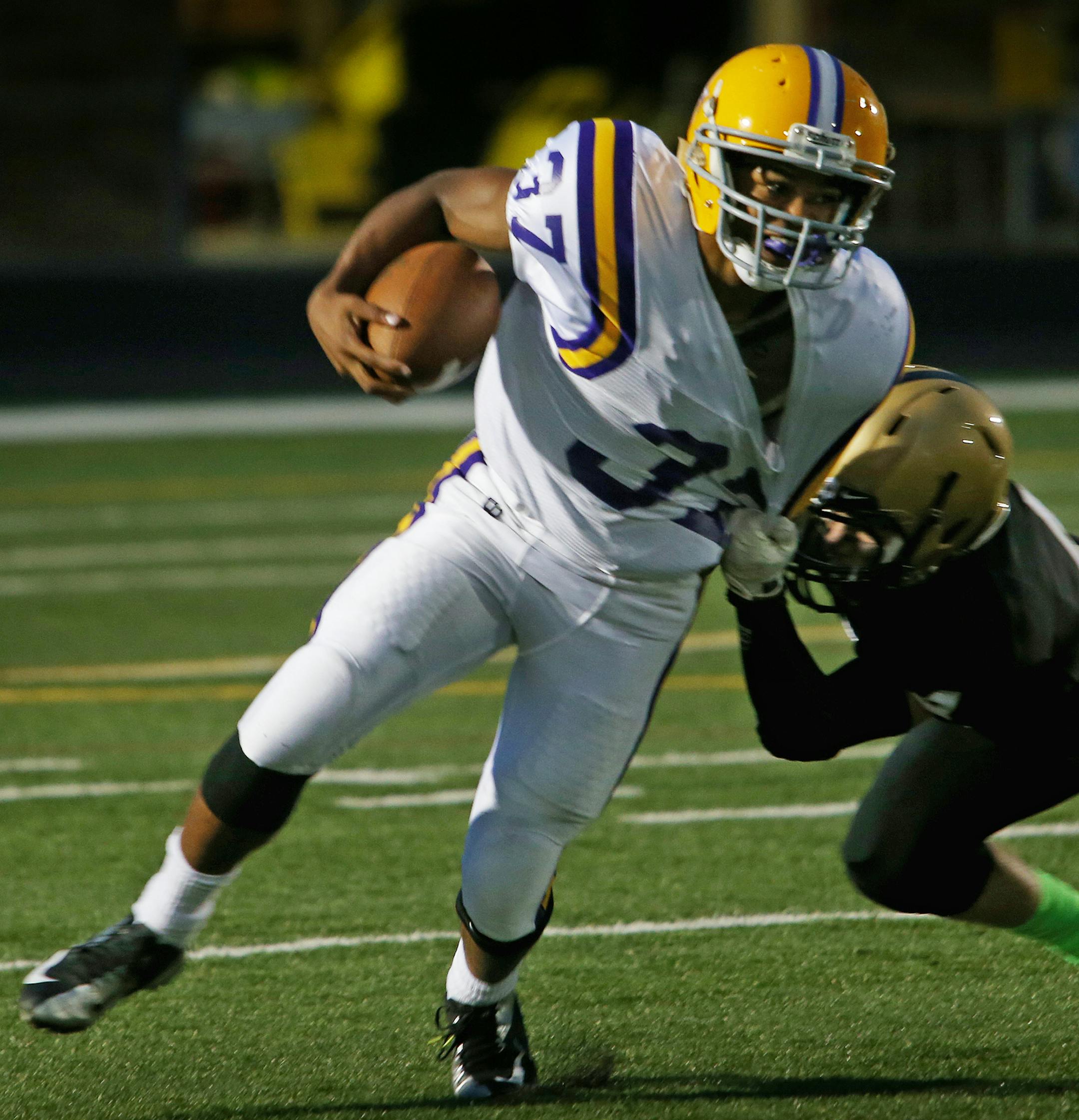 Brian Lankford-Jonson (37) is tackled by Sam Cobbs of East Ridge in the first quarter. Cretin-Derham Hall at East Ridge, Woodbury, MN. September 27, 2013. ] JOELKOYAMA‚Äö√Ñ¬¢joel koyama@startribune JC Hassenauer of East Ridge, Jashon Cornell of Cretin-Derham Hall ORG XMIT: MIN1309272012194453