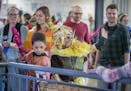 Students wearing hand-made costumes in the "Art Buddies" program, paraded through the Whittier Elementary halls for a school parade, Thursday, May 9, 