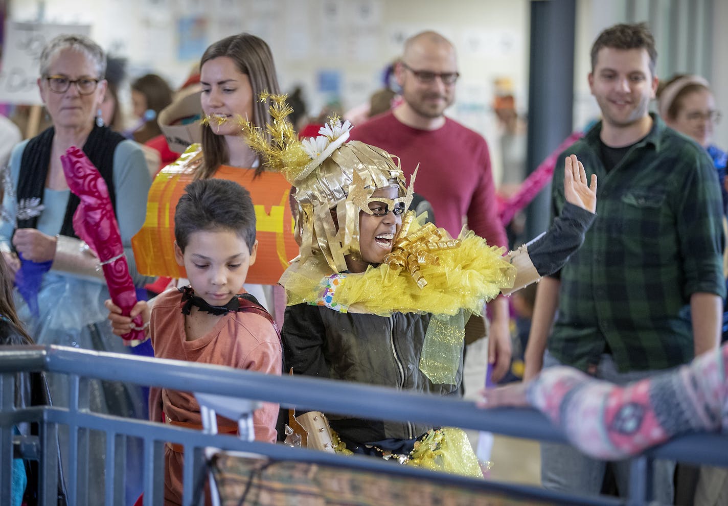 Students wearing hand-made costumes in the "Art Buddies" program, paraded through the Whittier Elementary halls for a school parade, Thursday, May 9, 2019 in Minneapolis, MN. The mentoring program matches adults from the Twin Cities advertising industry with at-risk elementary students. ] ELIZABETH FLORES &#x2022; liz.flores@startribune.com