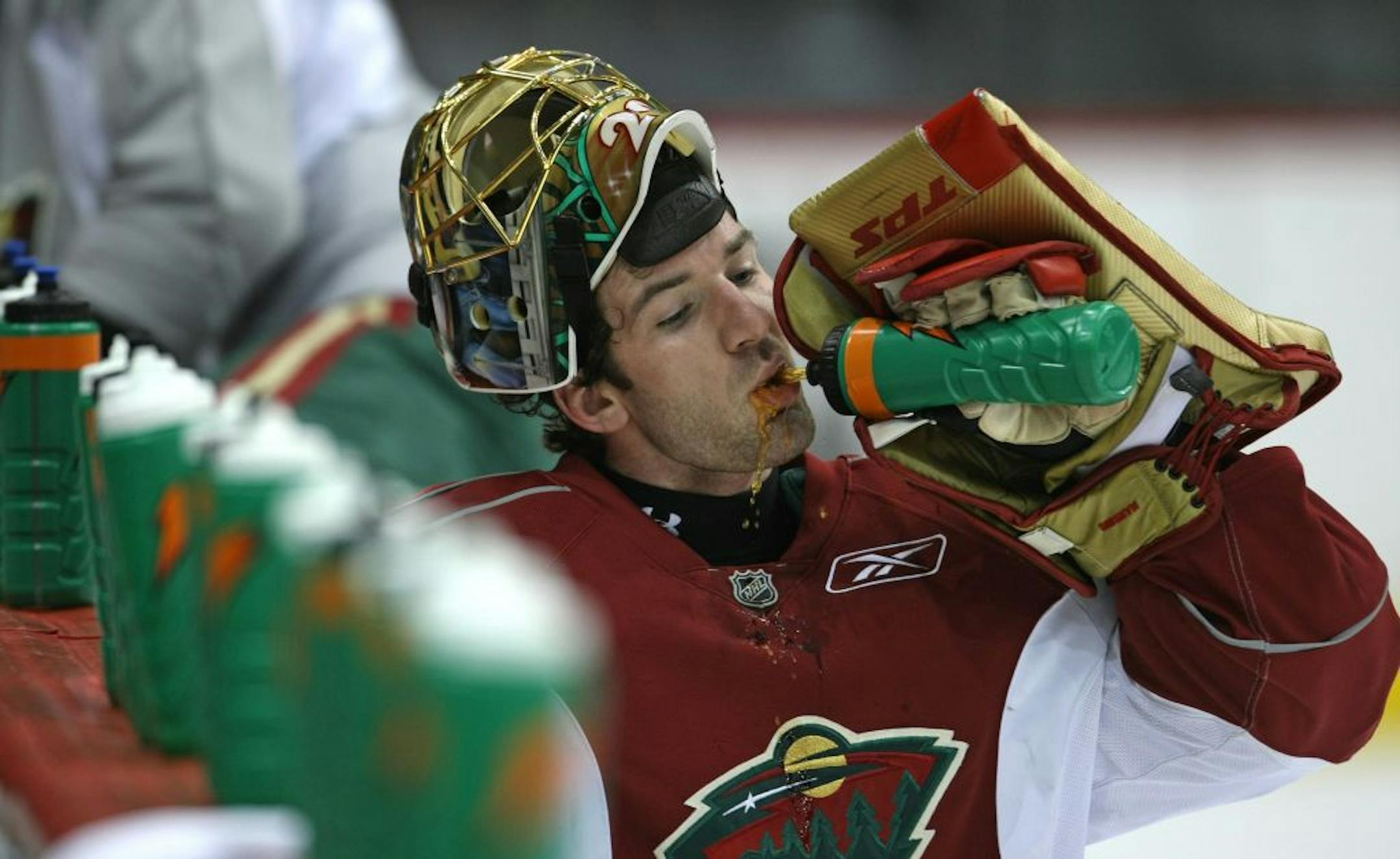 Minnesota Wild practice. (left to right) Wild goalie Josh Harding took a break from practice at Xcel.
