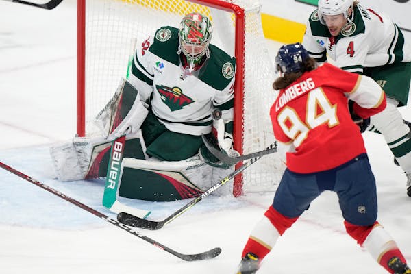 Filip Gustavsson blocks a shot from Florida Panthers left wing Ryan Lomberg during a game in January.