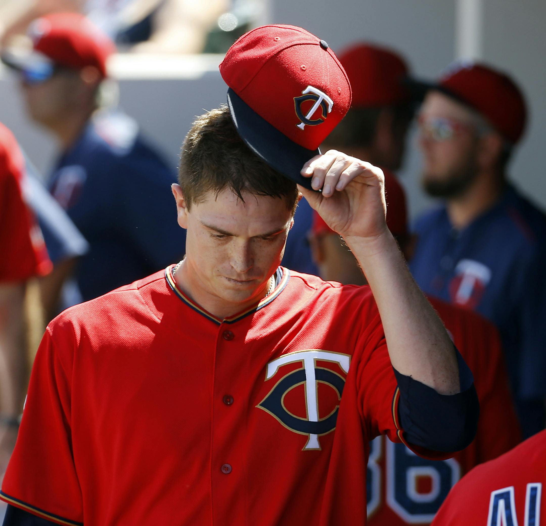 Minnesota Twins starting pitcher Kyle Gibson walks into the dugout after pitching an inning of a spring training interleague baseball game against the Miami Marlins in Fort Myers, Fla., Friday, March 11, 2016. (AP Photo/Patrick Semansky)