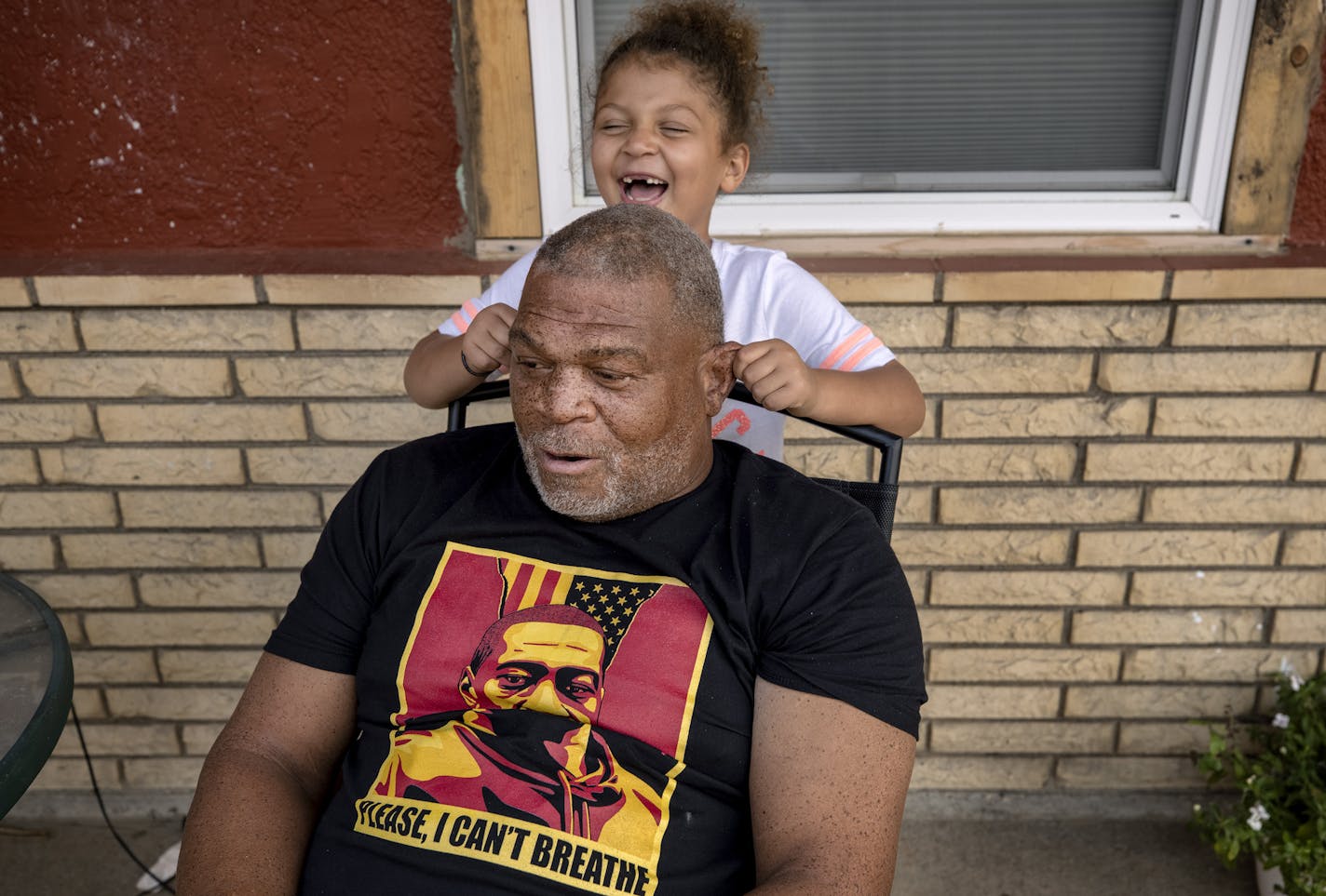 "There's progress in every place of the world — every nook and cranny — except in my little town." said Selwyn Jones, with his 7-year-old daughter Kashera in Gettysburg, S.D.