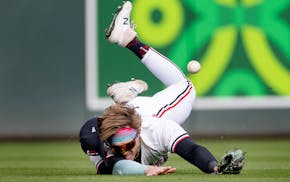 Twins left fielder Harrison Bader comes up short while diving for the ball in the sixth inning Thursday at Target Field.