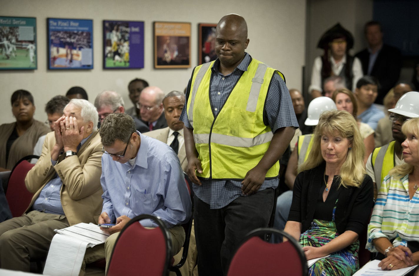 Summit Academy student Justin Cunningham challenged the stadium authority to provide the finding for minority jobs that is part of the bill passed by the Minnesota legislature. Friday, August 23, 2013 ] GLEN STUBBE * gstubbe@startribune.com Warren is Vikings V.P. of