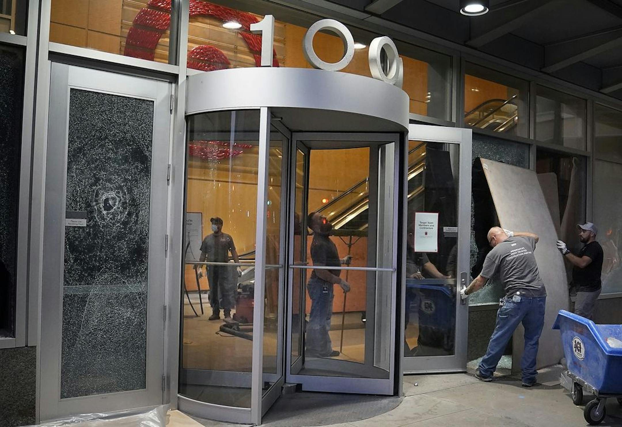 Cleanup outside Target headquarters on Nicollet Mall in Minneapolis following a night of rioting and looting on Aug. 25.