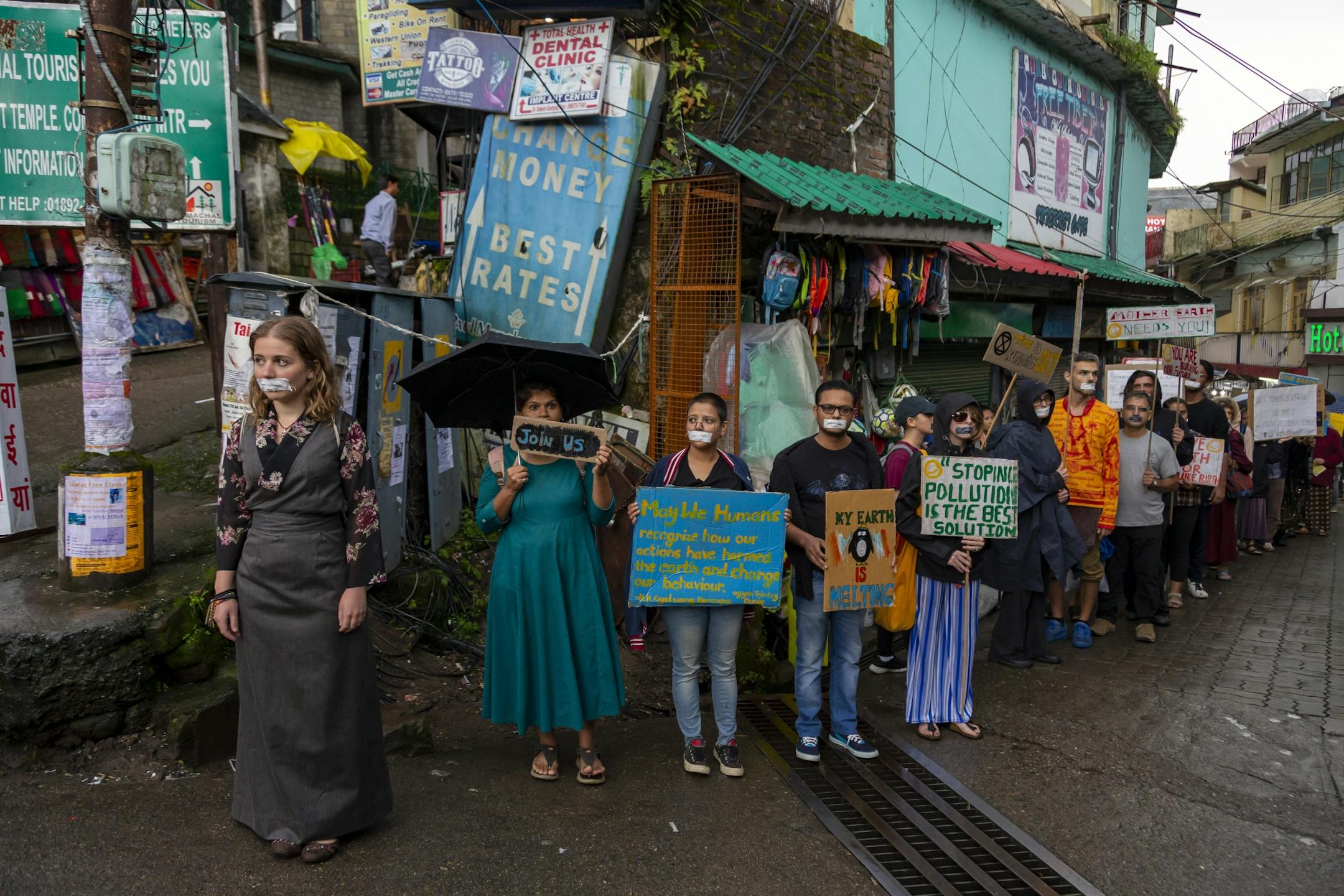 Activists hold placards at a street protest in Dharmsala, India, Friday, Sept. 20, 2019. The protestors gathered in response to a day of worldwide demonstrations calling for action to guard against climate change began ahead a U.N. summit in New York.