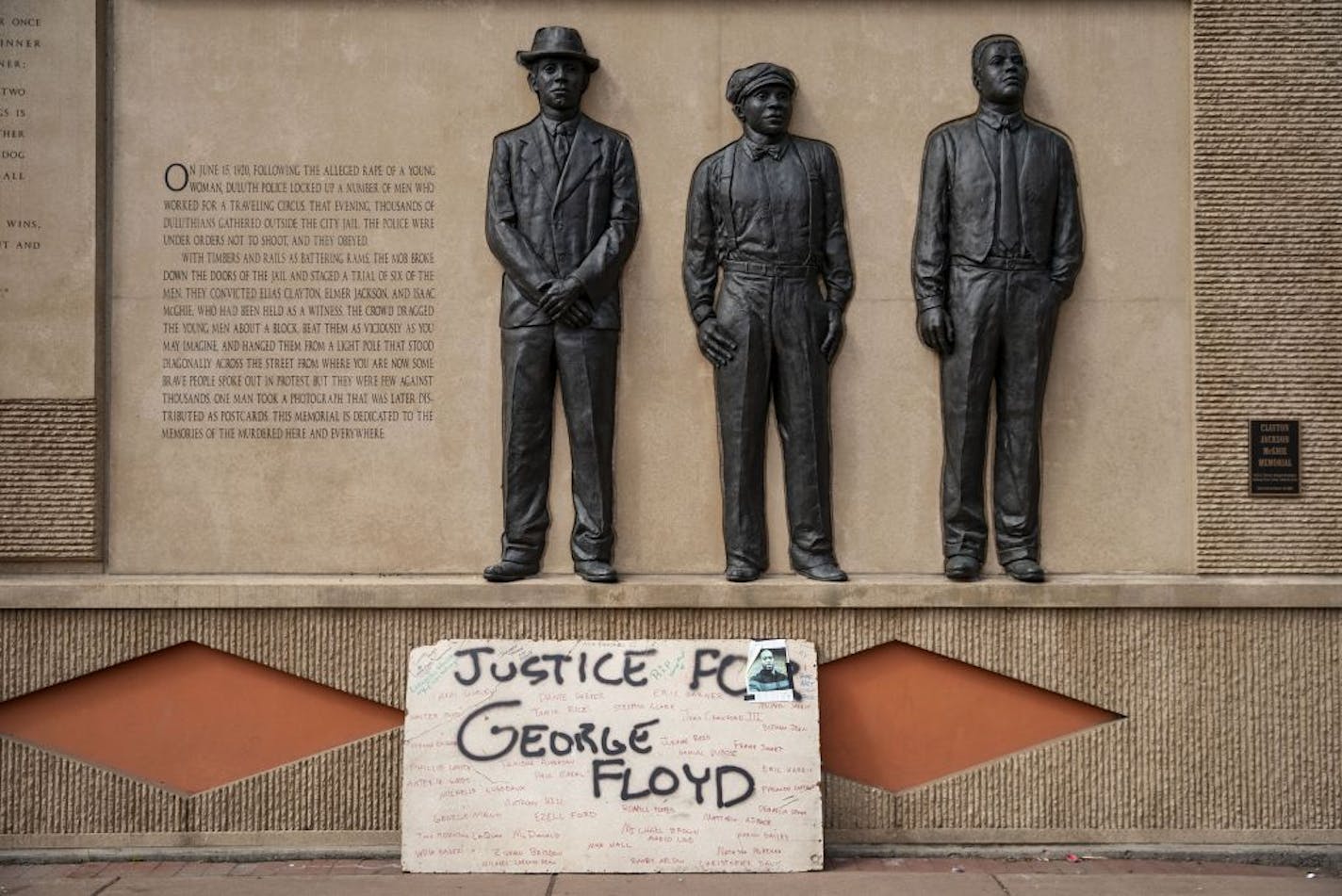 The Clayton Jackson McGhie Memorial in Duluth, MN was covered in chalk drawings and littered with candles as the site for honoring both George Floyd and the 100 year anniversary of the three men's death by public lynching.